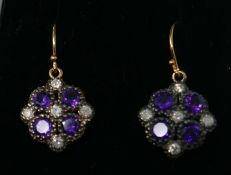 A boxed pair of yellow gold, diamond and amethyst cluster drop earrings, each earring set with 5