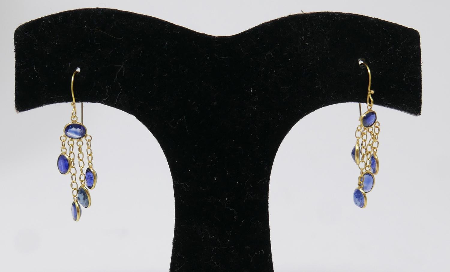 A pair of 14ct yellow gold, natural sapphire drop earrings, each earring set with five, oval,