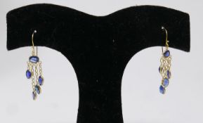 A pair of 14ct yellow gold, natural sapphire drop earrings, each earring set with five, oval,