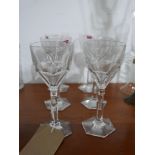 A set of 6 large, Baccarat, French crystal faceted wine glasses to hexagonal bases, H: 19cm.