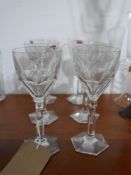 A set of 6 large, Baccarat, French crystal faceted wine glasses to hexagonal bases, H: 19cm.