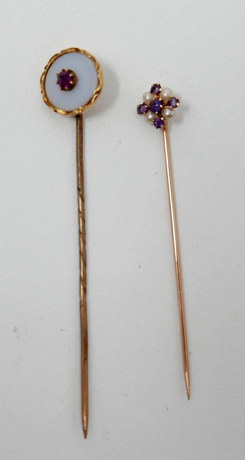 Two, Victorian, yellow gold stick pins: circular white agate and ruby example L: 6.5cm and