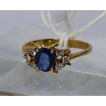 An 18ct yellow gold, natural Ceylon sapphire and diamond ring, the central, faceted oval, '