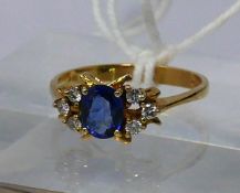 An 18ct yellow gold, natural Ceylon sapphire and diamond ring, the central, faceted oval, '