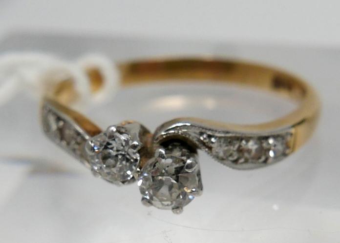 A boxed, late 19th century, 18ct yellow gold and platinum double diamond crossover ring, centrally