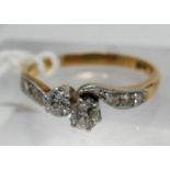 A boxed, late 19th century, 18ct yellow gold and platinum double diamond crossover ring, centrally
