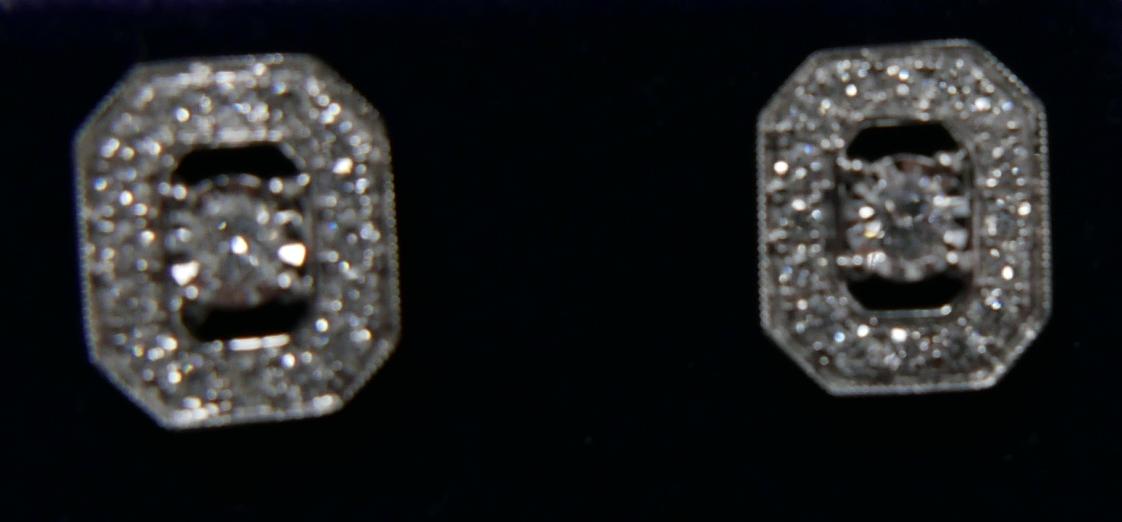 A pair of 18ct white gold and diamond stud earrings (0.50 carats), each earring set with a central - Image 3 of 3