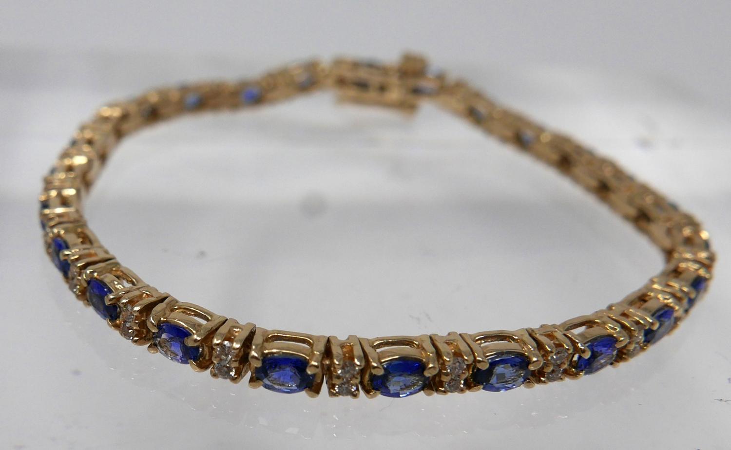 A 14ct yellow gold diamond and tanzanite tennis bracelet set with alternating stones of 50 - Image 3 of 4