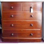 A mahogany chest of two short over three long drawers, raised on bun feet, H.116 W.120 D.48cm