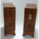 A pair of Art Deco walnut pedestal chests, H.73 W.27 D.52cm