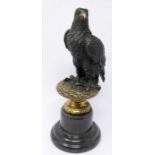 After Archibald Thornburn, a bronze study of an eagle on a perch, bearing signature and plaque,