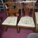 A pair of Georgian mahogany dining chairs, with tapestry drop in seat, in the Chippendale taste