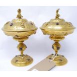 A pair of 19th century Italian gilt bronze tazzas and covers, with figural and floral decoration,