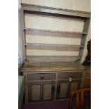 A Victorian painted pine dresser with open plate rack above base fitted with drawers and