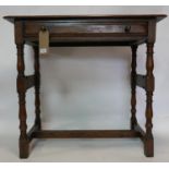 A 17th century style Ipswich oak side table fitted frieze drawer on turned stretchered supports. H.