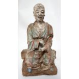 A Chinese early Ming Dynasty stucco figure of Lohan, polychrome painted, with paperwork from