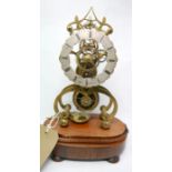 A 19th century brass skeleton clock, the dial marked 'Wales Leeds', raised on rosewood base, H.30cm