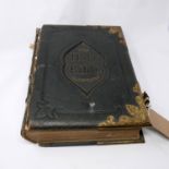 A 19th century illustrated holy bible with brass mounts, front cover loose