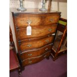 A Georgian style mahogany serpentine fronted chest of drawers. H.108 W.68 D.49cm