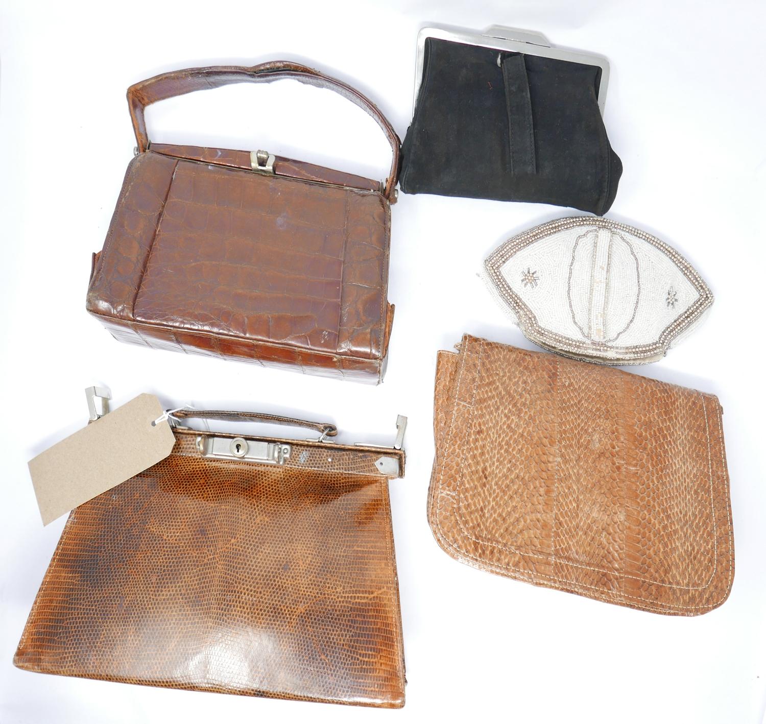 A collection of handbags and clutches, to include a snakeskin handbag, snakeskin clutch, and two