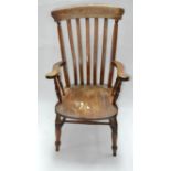 An early 20th century oak Windsor armchair