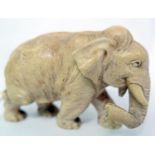 A 19th century Chinese fine carved ivory elephant signed with character marks to base, H.7cm