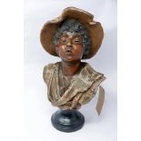 A 19th century plaster bust of young boy in a hat, on socle base, H.49cm