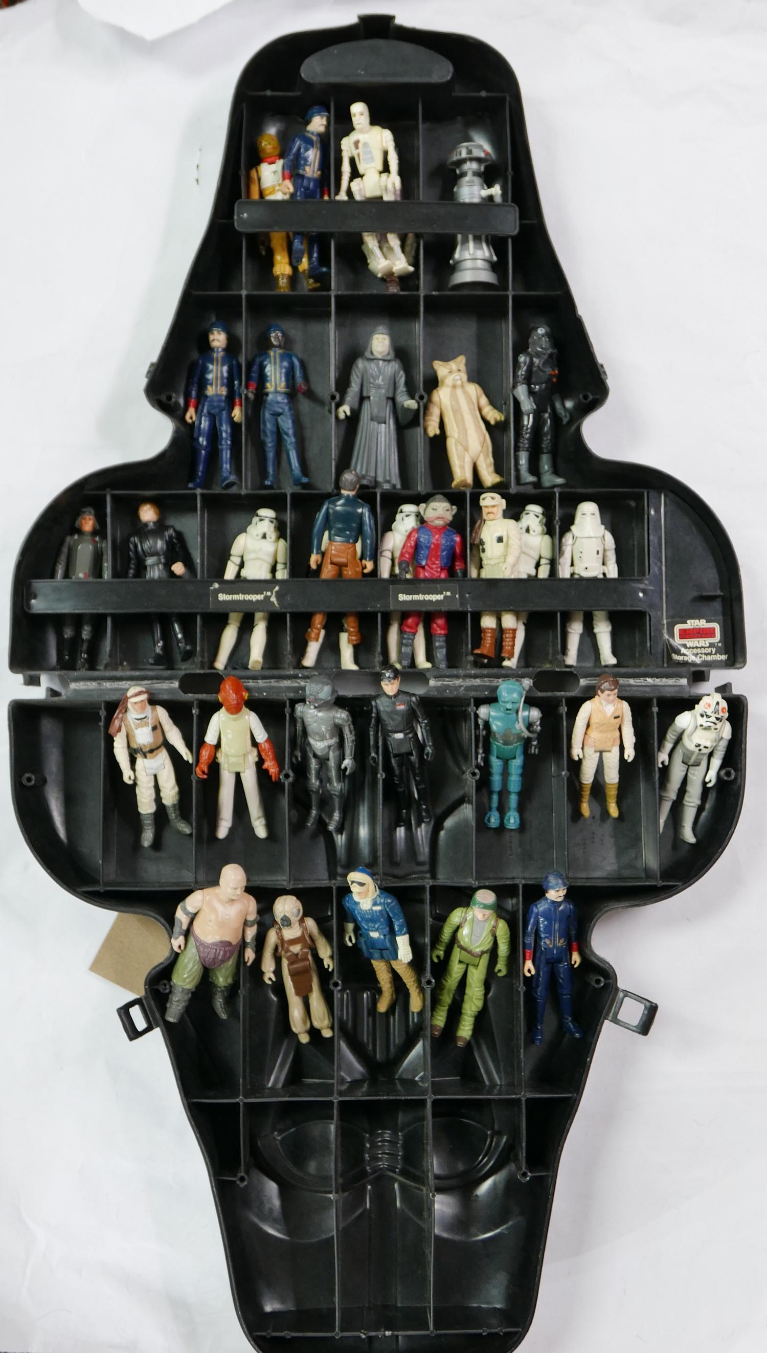 A mixed collection of Star Wars figurines, in a Star Wars Empire Strikes Back accessory storage