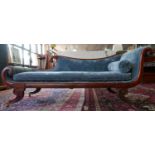 A Regency inlaid mahogany chaise lounge, with blue velour upholstery, on scrolling supports, H.80