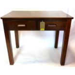 An early 20th century oak two drawer desk, H.76 W.90 D.60cm
