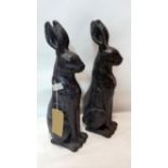 A pair of ceramic seated hares, H.55cm