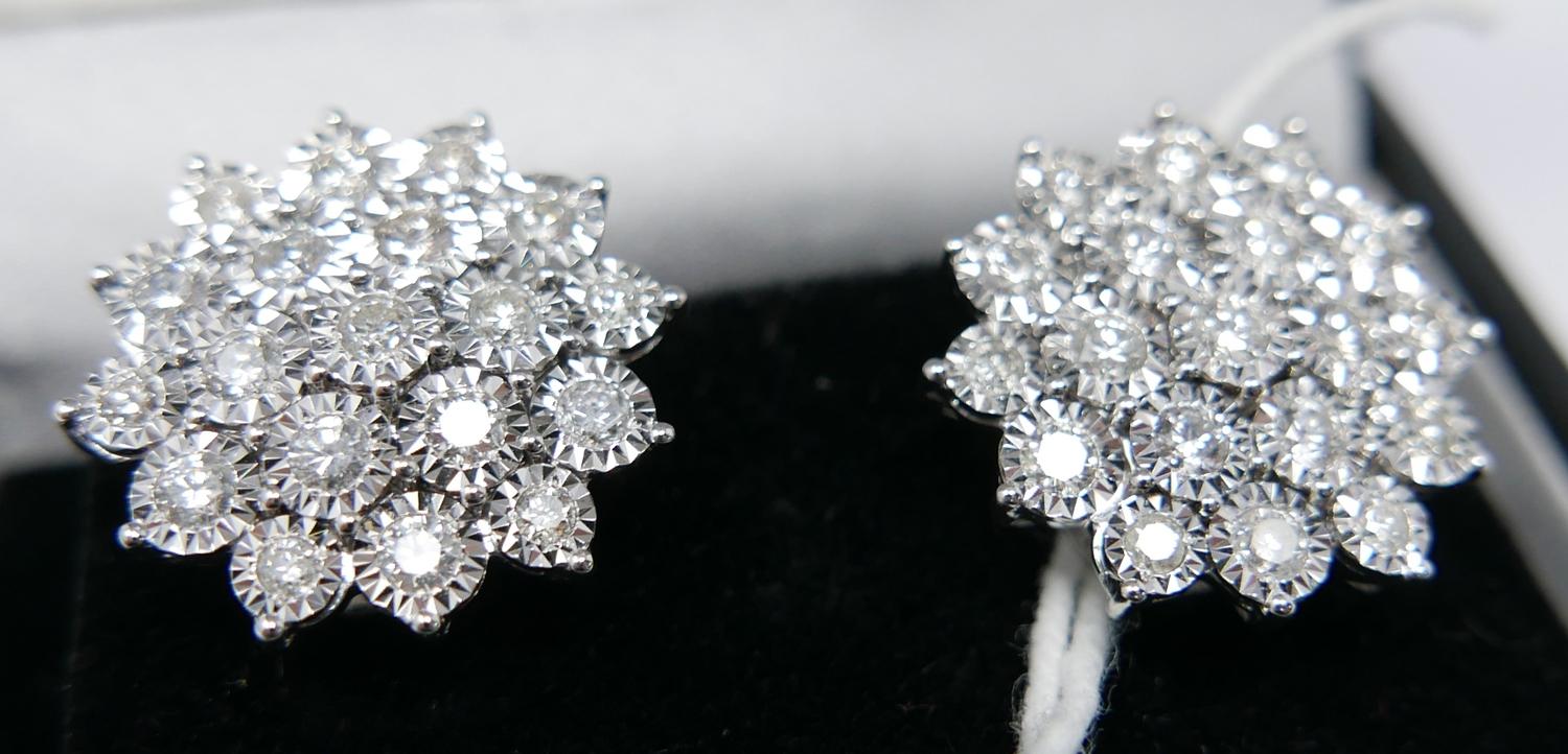 A boxed pair of 18ct white gold, diamond cluster stud earrings (Total: 2 carats), each earring set