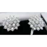 A boxed pair of 18ct white gold, diamond cluster stud earrings (Total: 2 carats), each earring set