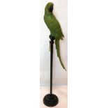 A resin parrot perched on a stand, H.123cm