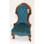 A Victorian mahogany spoon back chair with blue velour button back upholstery, raised on cabriole