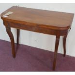 A Regency mahogany fold over tea table, raised on ebony inlaid sabre legs, H.73 W.91 D.44cm