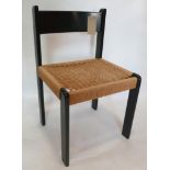 A Danish ebonised chair with rattan seat