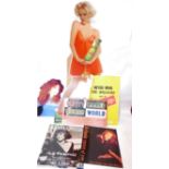 A collection of cardboard cut out advertising and posters, to include Stella Artois, Kate Bush, a