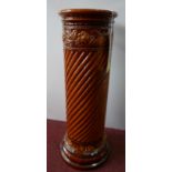 A Victorian Burmantoft brown glazed jardiniere stand, H.63cm