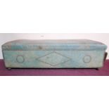 An early 20th century stud bound distressed green leather ottoman, raised on bun feet, H.35 W.127
