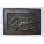 A 19th century carved oak panel depicting a figure riding a chariot, 29 x 41cm