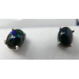 A boxed pair of sterling silver and black opal cabochon stud earrings, 7 x 5mm, 1.2g