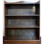 A mid 20th century oak open shelved bookcase on plinth base, H.101 W.74 D.24cm