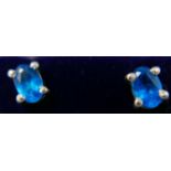 A boxed pair of sterling silver and blue faceted appetite oval-shaped stud earrings, 5 x 4mm, 1.1g