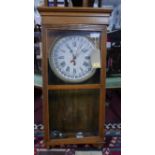 A Sessions Clock Co. oak cased calendar clock, 8 day movement, the dial with Roman numerals and