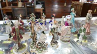 A collection of ceramic figures to include 5 Capodimonte soldiers, Royal Doulton seated gentleman, 3