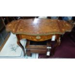A late 19th century French walnut drop leaf side table, with floral parquetry inlay and gilt metal