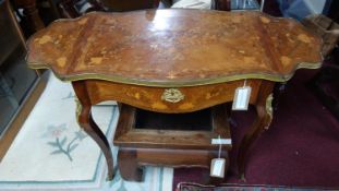 A late 19th century French walnut drop leaf side table, with floral parquetry inlay and gilt metal