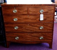 A Georgian mahogany chest of two short over three long drawers, raised on outswept feet, H.105 W.103