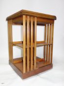A yew wood revolving bookcase, H.71 W.48 D.48cm